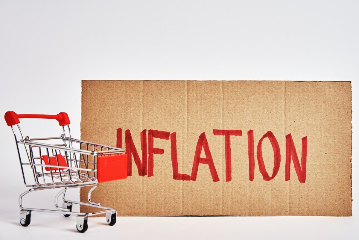 Consumers inflation concept, shopping trolley and word inflation