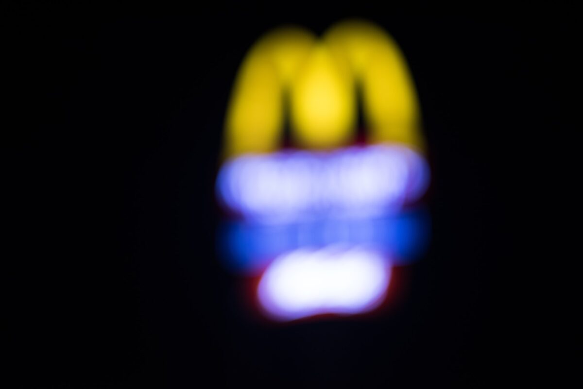 Blurred background of McDonald’s signage at night