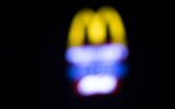 Blurred background of McDonald’s signage at night