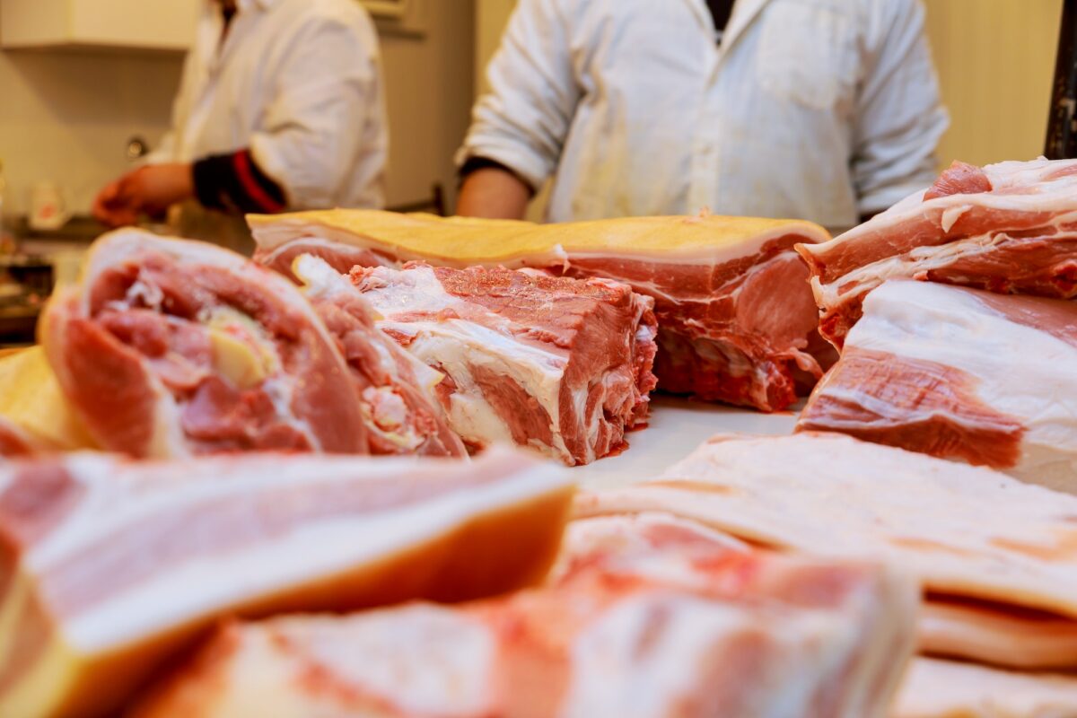 Raw sliced meat with spices, food concept. disassembly of pork carcass in the market