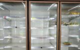 almost empty freezer at the supermarket during corona virus covid 19 lockdown