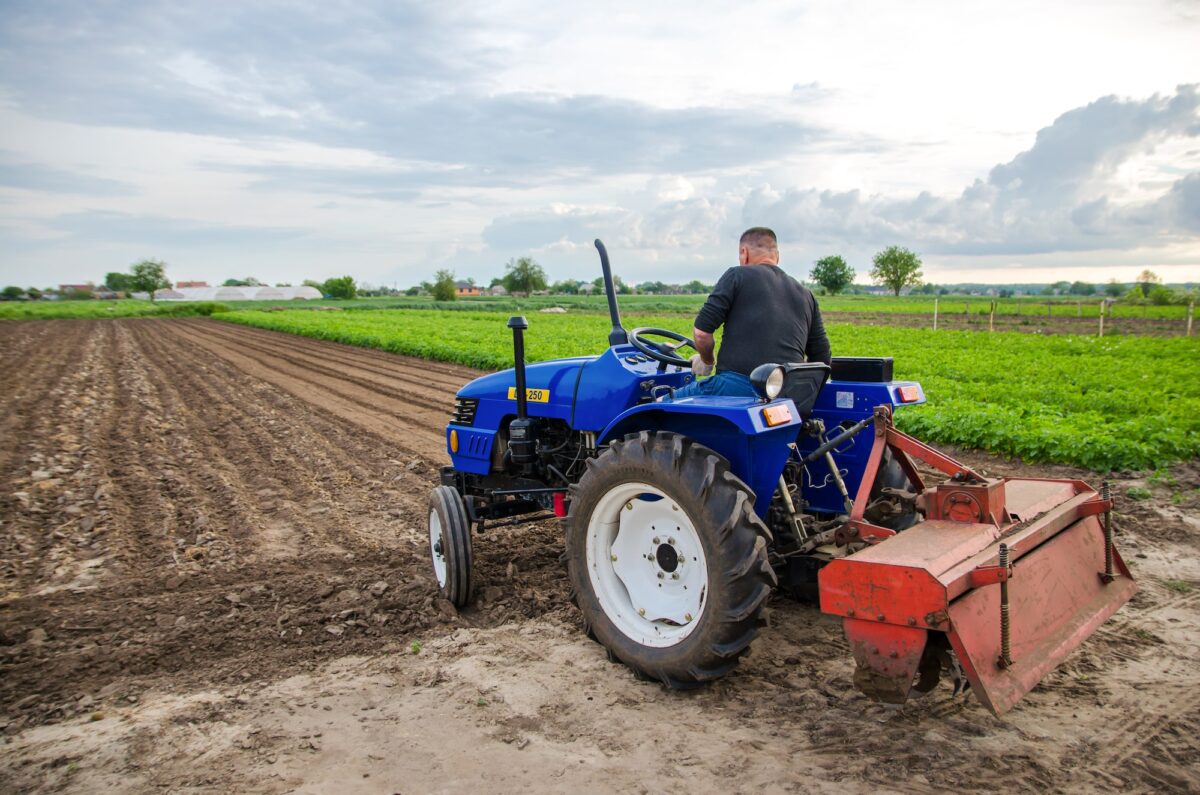 Kherson oblast, Ukraine - May 29, 2021: A farmer on a tractor clears the field.