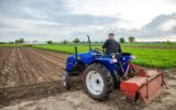 Kherson oblast, Ukraine - May 29, 2021: A farmer on a tractor clears the field.